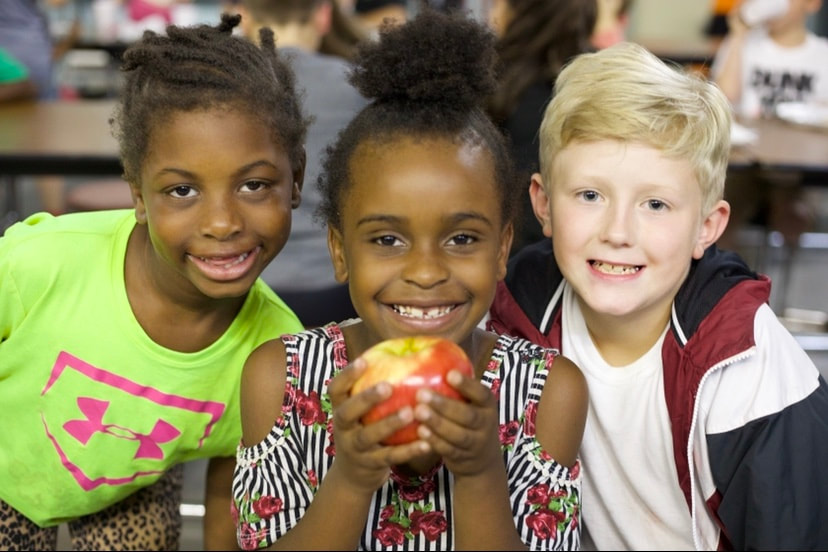 Nutrition services - children eating fruit